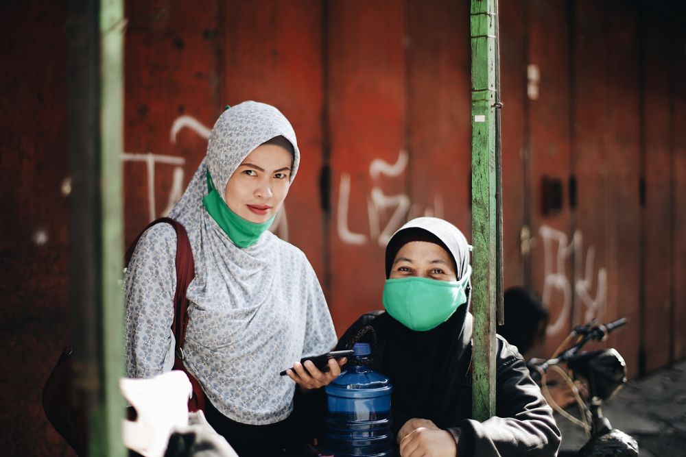 Indonesian women in PPE face masks