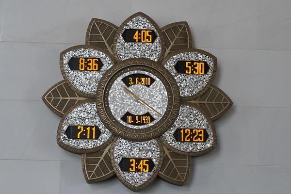 5 prayer times on clock in Abu Dhabi
