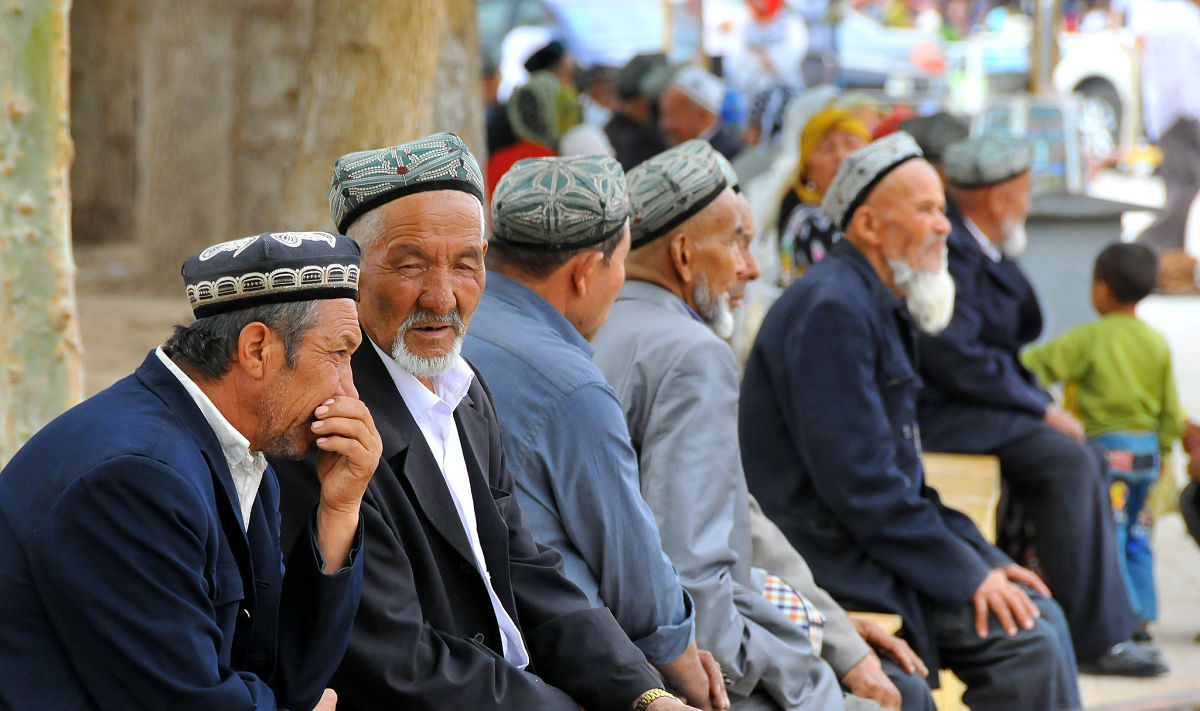 Uyghur chinese men talking
