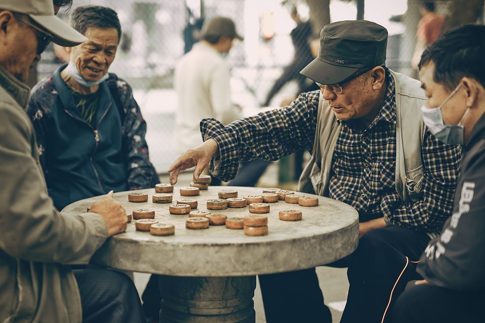 Chinese men playing board game