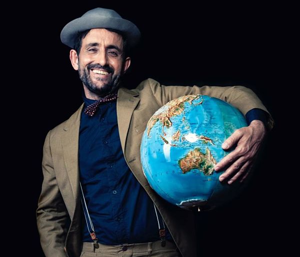 cultured man holding world globe