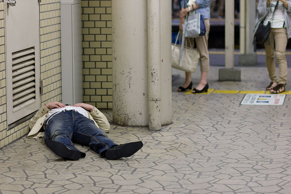 drunk man floor japan metro