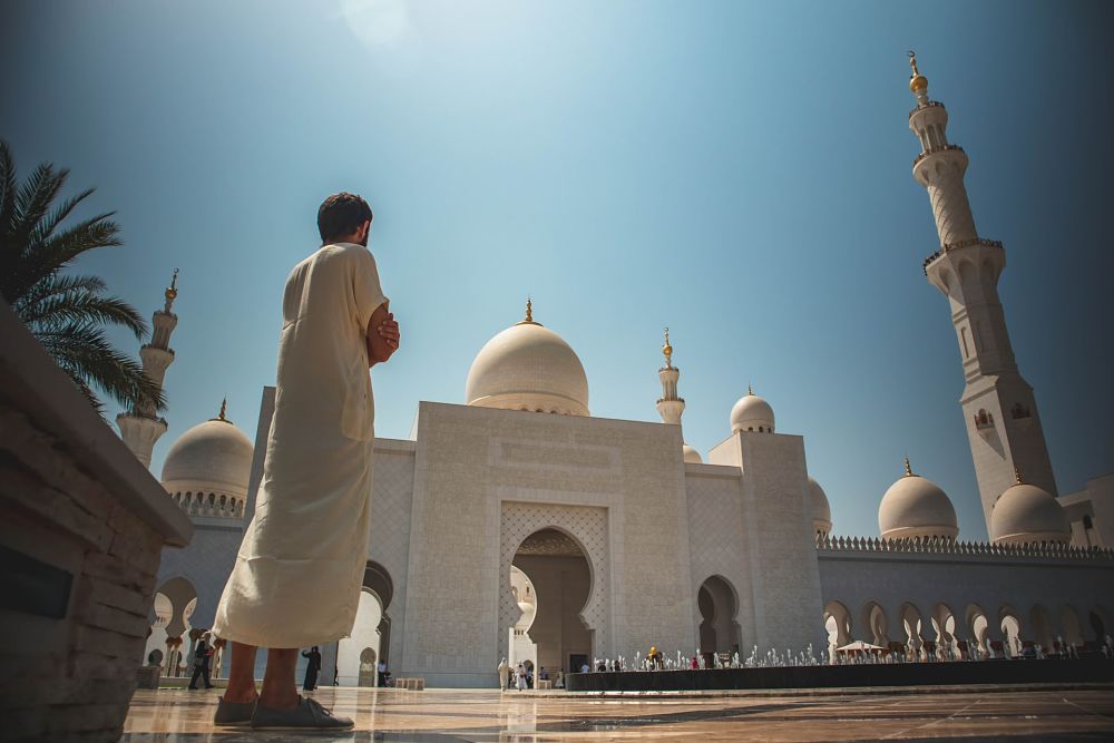 man in grand masjid abudhabi