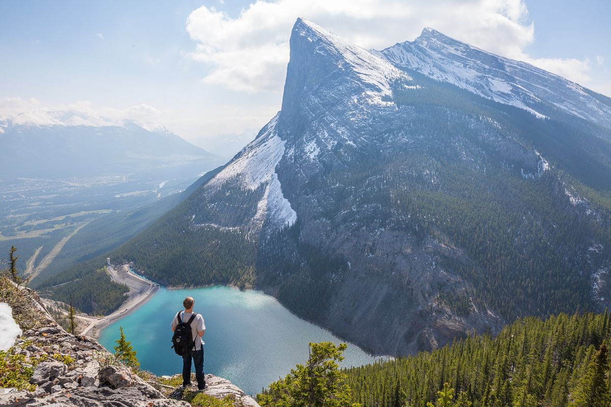 man stares at canadian mountains
