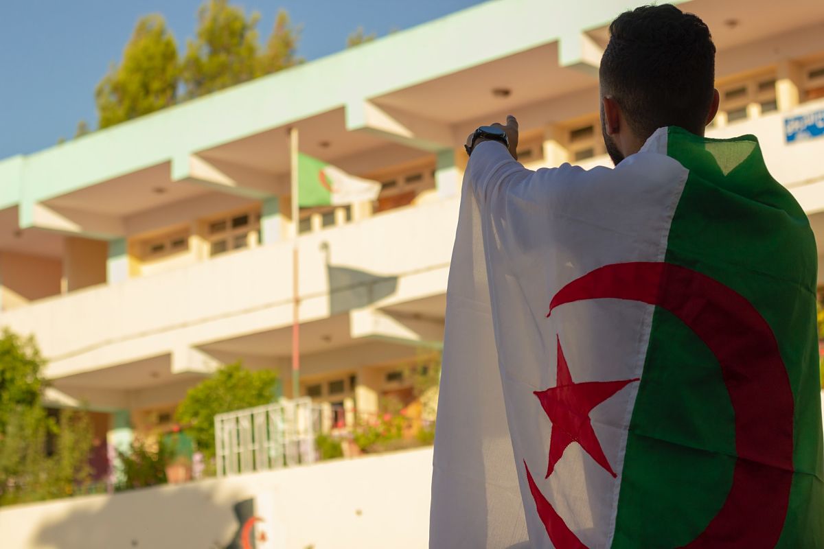 man wearing algerian flag