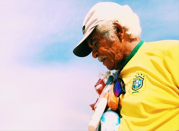 Old Brazilian Man Sporting Yellow Soccer Jerset