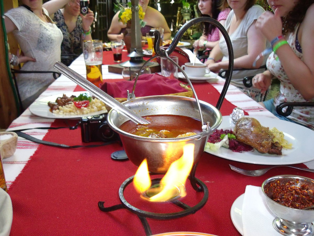 people eating goulash