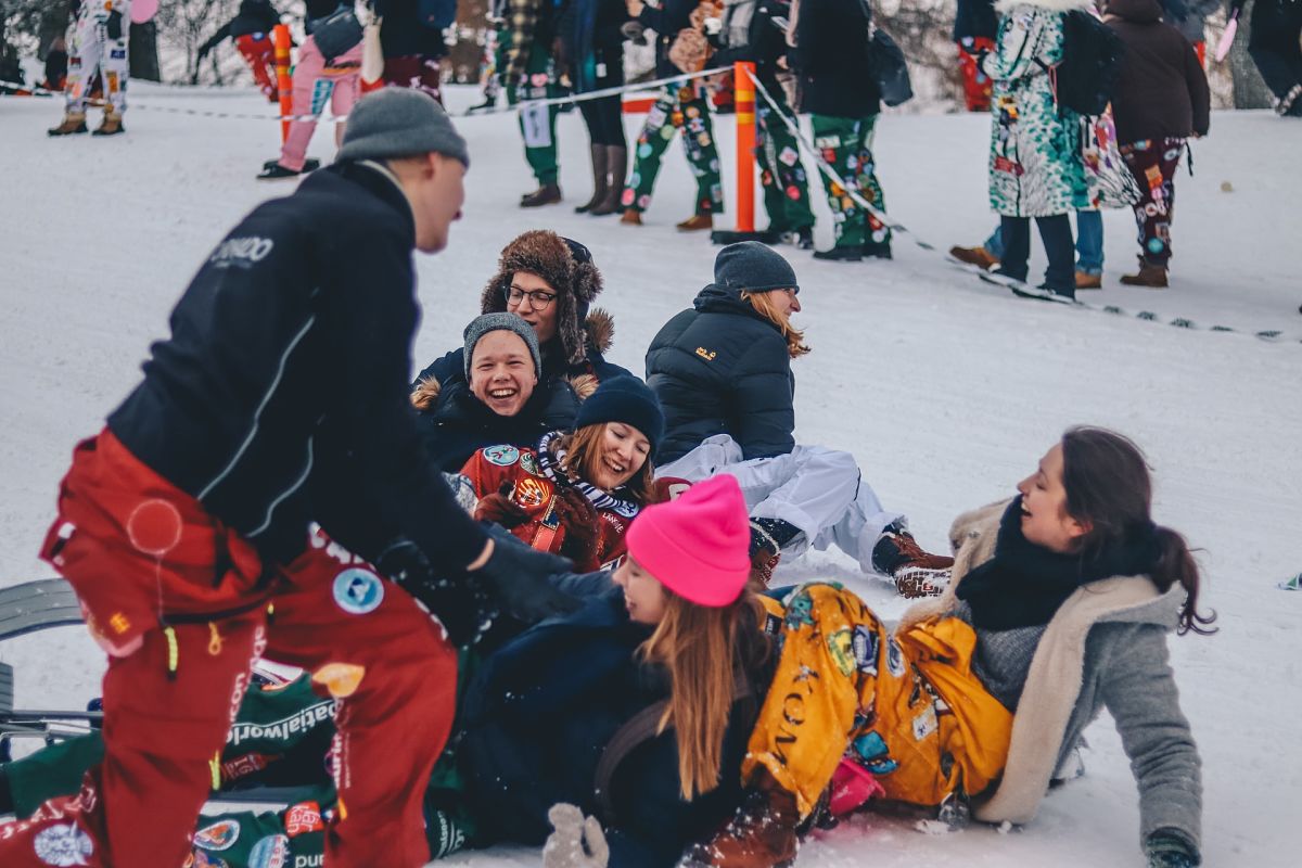 people laughing in snow