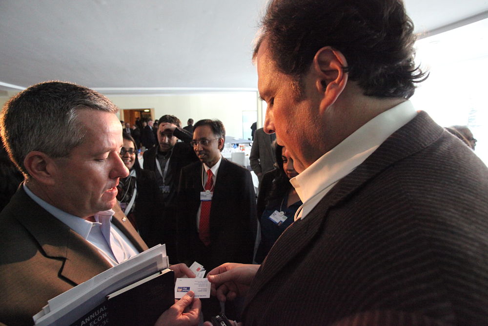 Salesforce.com CEO Marc Benioff exchanges business cards
