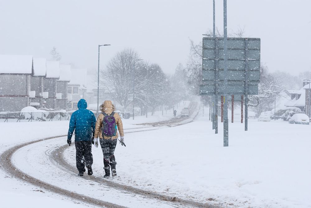 two ppl in snow UK