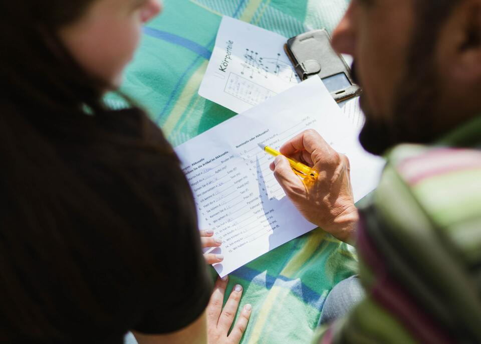 teacher giving feedback to student