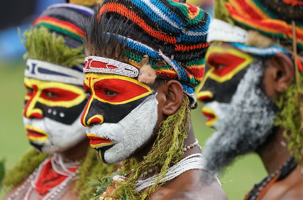 men in tribal face paint